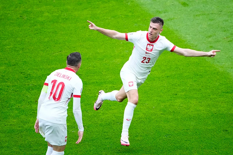 Krzysztof Piatek celebrates after scoring Polands first goal
